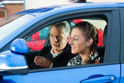 Young woman at driving lesson
