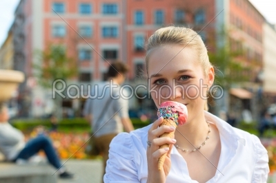 Young woman eats Ice cream