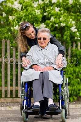 Young woman is visiting her grandmother in nursing home