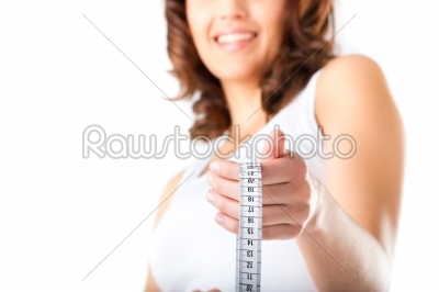 Young woman with measuring tape