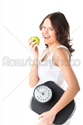 Young woman with scale under her arm and apple