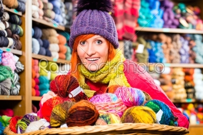 Young women in knitting shop