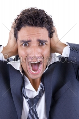 adult man in suit holding his head and screaming
