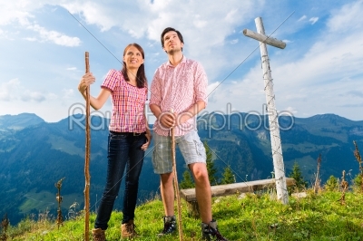 Alps - Hiking Couple takes break in mountains