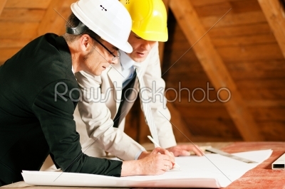 Architect and construction engineer discussing plan