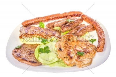 barbecue of various grilled meat on white plate closeup