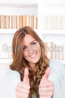 beautiful attractive woman showing thumbs up
