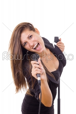 beautiful girl holding microphone and singing loud in black dres