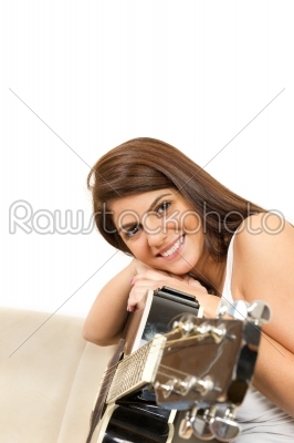 beautiful girl with a guitar smiling