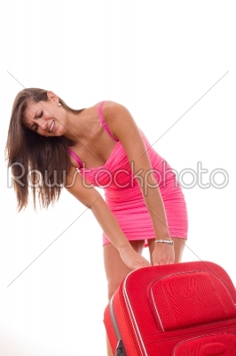 beautiful girl with heavy suitcase for travel