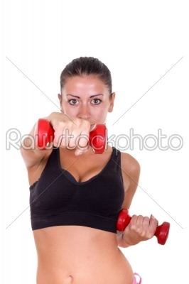 beautiful sporty woman exercising and lifting weights dumbbells