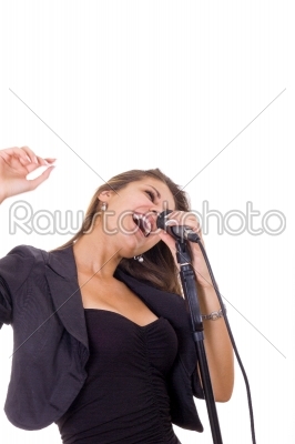 beautiful woman enjoying music singing on microphone