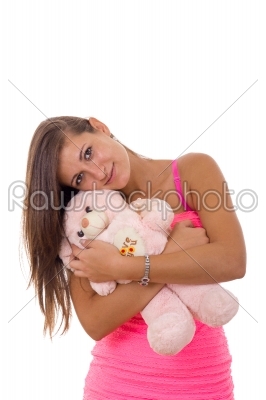 beautiful young woman holding teddy bear and hugging him smiling