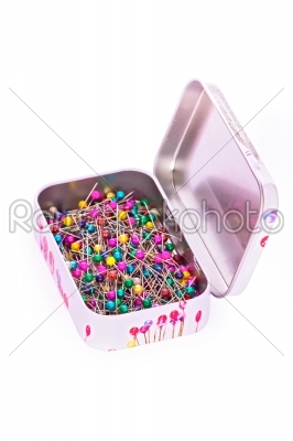 Box of sewing pins in metall box isolated on white. Object with clipping path