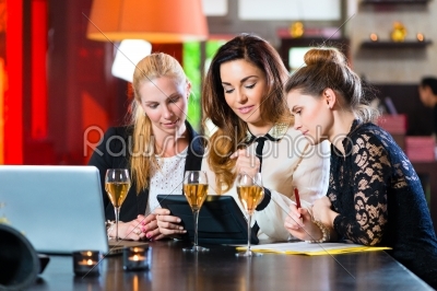 Business Colleagues working with documents in a cafe