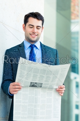 Businessman reading  business newspaper