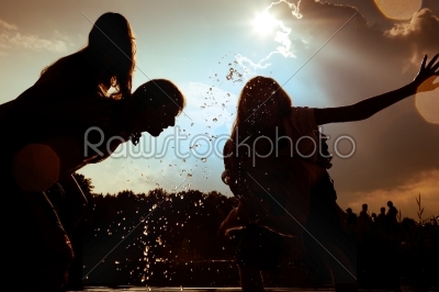 Carefree summer - friends in silhouette