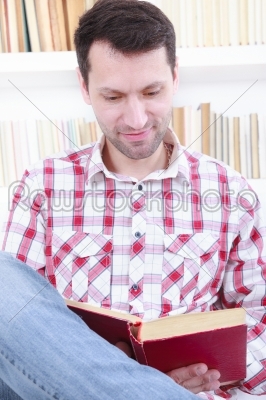 casual male reading a book