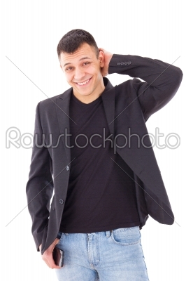 casual shy man in a black suit jacket and jeans