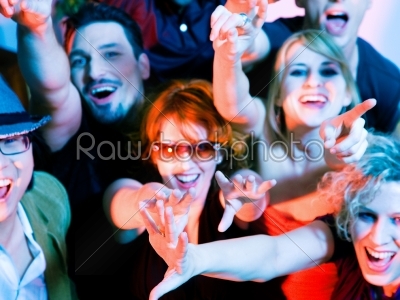 Cheering crowd in disco club