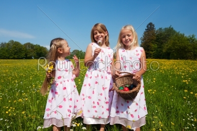Children on Easter egg hunt with baskets