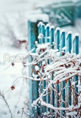 Close up of a winter fence with grass