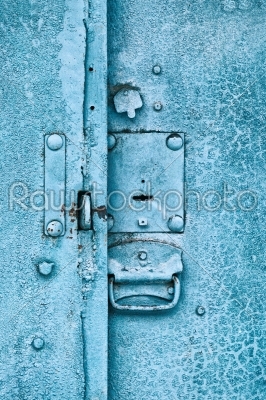 Close up of padlock and old metal hasp on an vintage door