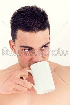 closeup of sexy man drinking coffee