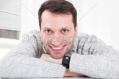 Closeup portrait of a young attractive man with great toothy smi