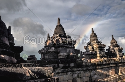 Clouds and Rainbow Buddist temple Borobudur complex in Yogjakart