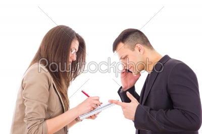 confused businessman on the phone and his secretary