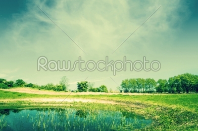 Countryside landscape with a pond