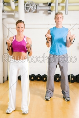 Couple doing Tube Training in gym