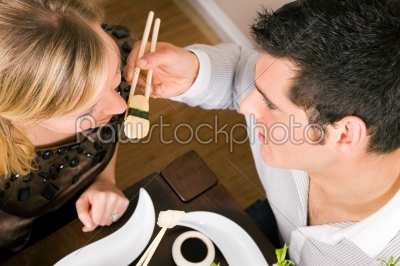 Couple eating Sushi