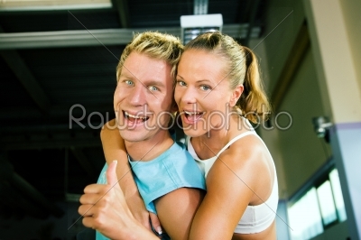 Couple having fun in gym