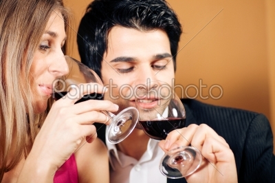 Couple having red wine