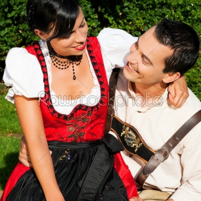 Couple in traditional Bavarian dress in summer