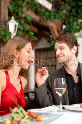 Couple on romantic date at a restaurant