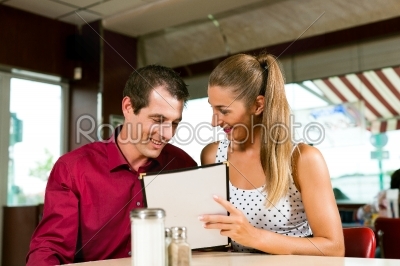 Couple order in a bar or restaurant