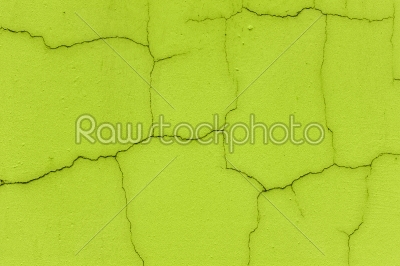 Cracked wall in neon green color