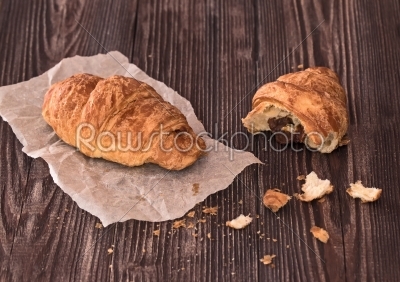 croissant for breakfast on a dark wooden table