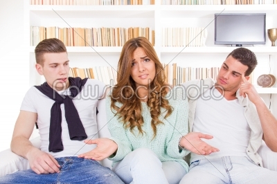 doubtful woman choosing between two young men