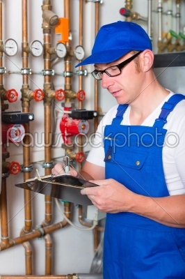 Engineer controlling the heating system