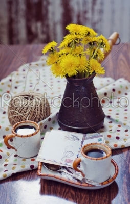 Espresso cup with dandelion flower on turk