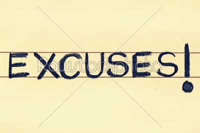 excuses word handwritten on black chalkboard