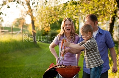 Family having BBQ in their garden