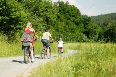 Family rides the bike