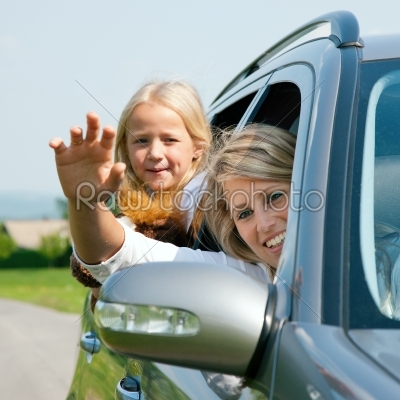 Family travelling by car