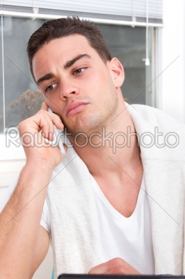 focused casual handsome man talking on mobile