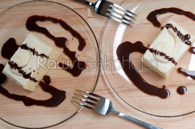fresh cream cake closeup with chocolate sauce